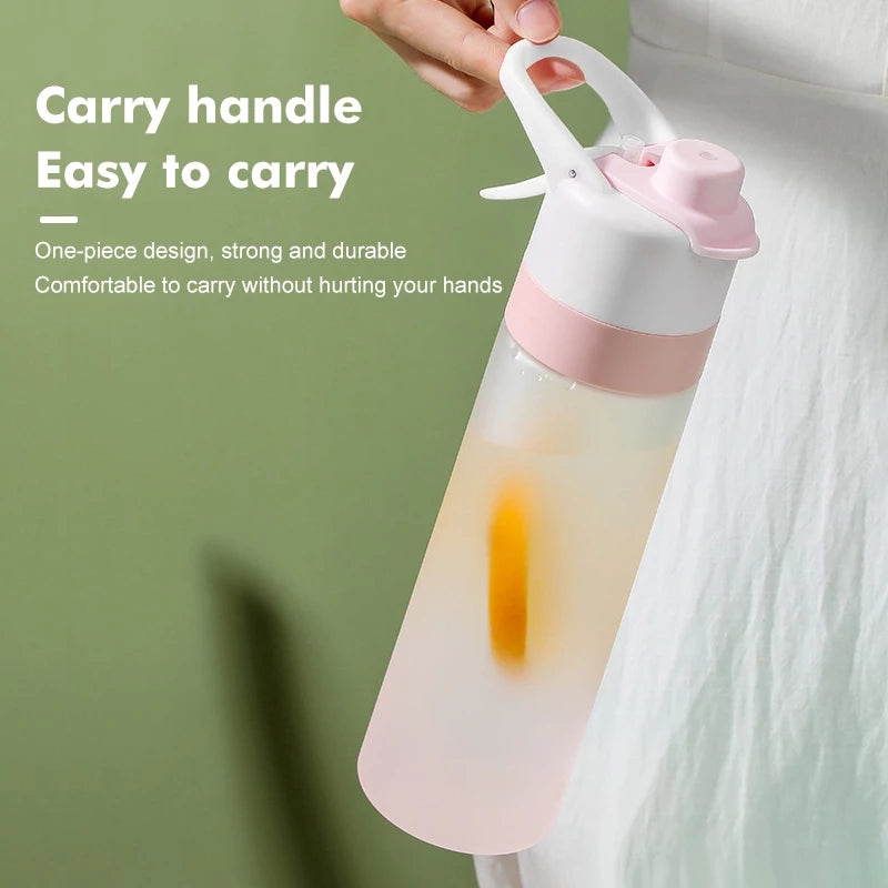 Water bottle with spray feature