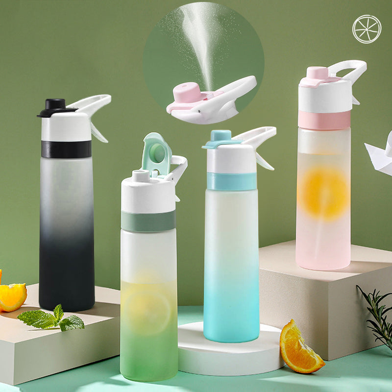 Water bottle with spray feature